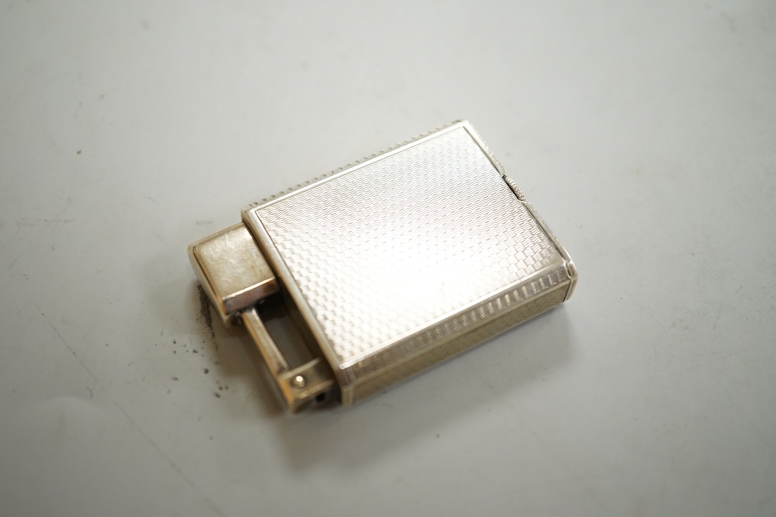 Two vintage lighters comprising an Everest 925 silver lighter, 49mm and a Dunhill plated lighter